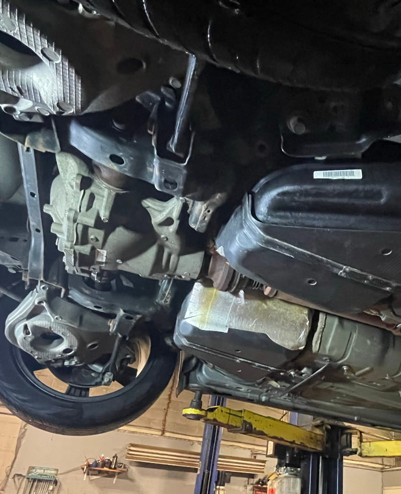 Vehicle undercarriage being checked