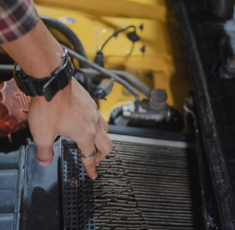 A mechanic changing the air filter